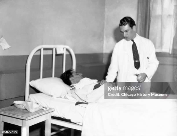 Capone's enforcer, Frank Nitti, lays in a hospital bed after having been shot by police, Chicago 1932. Nitti recovered and was eventually indicted...