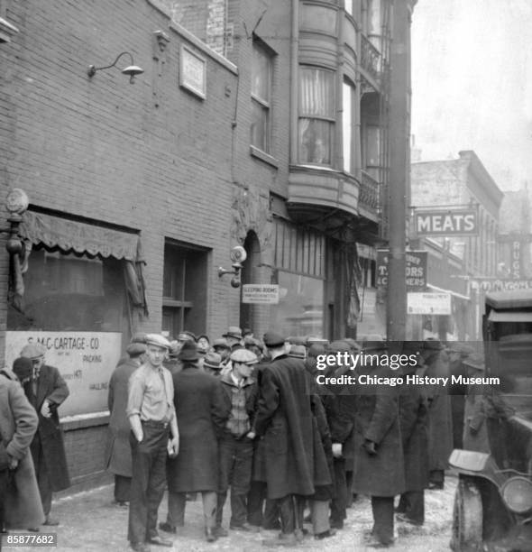 Crowd gathers outside the scene of the St. Valentine's Day Massacre, Chicago February 1929.