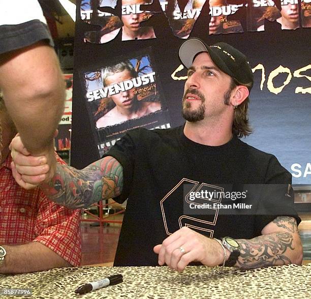 Sevendust guitarist John Connolly greets fans at the Wow! store October 27, 2001 in Las Vegas, Nevada. The band will release the album, "Animosity"...