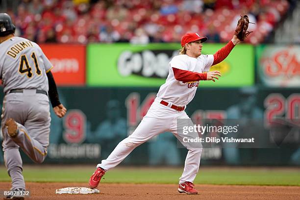 Khalil Greene of the St. Louis Cardinals attempts to turn a double play against Ryan Doumit of the Pittsburgh Pirates on April 9, 2009 at Busch...