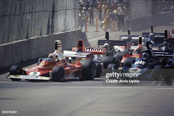 Clay Regazzoni's Ferrari 312T leads Patrick Depaillier's Tyrell Ford into the first turn of the first United States Grand Prix West held on March 28,...