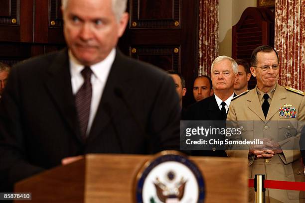 Chairman of the Joint Chiefs of Staff Admiral Mike Mullen and U.S. Pacific Commander Admiral Timothy Keating listen to U.S. Defense Secretary Robert...