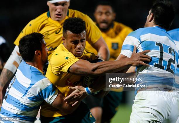 Will Genia of Australia is tackled by Martin Landajo of Argentina during The Rugby Championship match between Argentina and Australia at Malvinas...