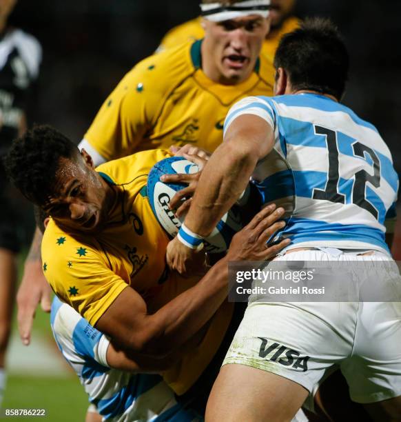 Will Genia of Australia is tackled by Martin Landajo of Argentina during The Rugby Championship match between Argentina and Australia at Malvinas...