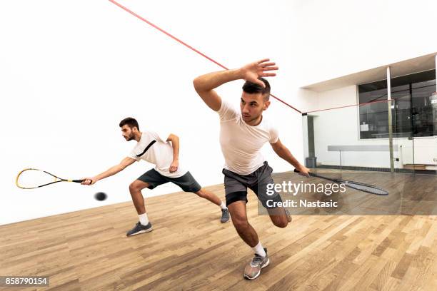 men playing squash on court - squash sport stock pictures, royalty-free photos & images