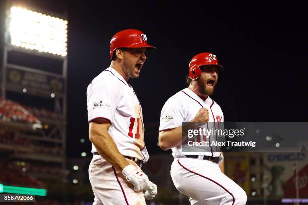 Ryan Zimmerman celebrates with Daniel Murphy of the Washington Nationals after hitting a three-run home run in the eighth inning during Game 2 of the...