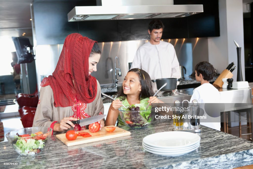 Arab family in kitchen.