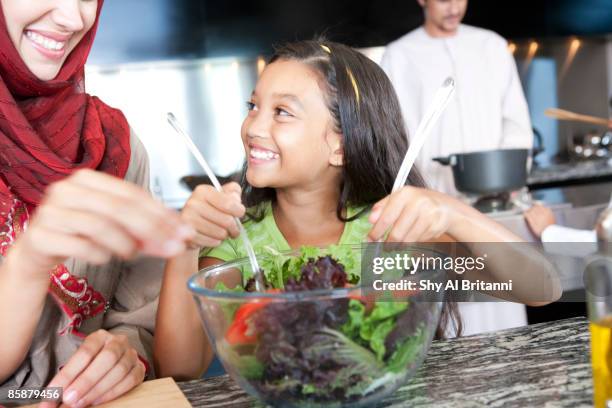 arab family cooking in kitchen. - jalabib imagens e fotografias de stock