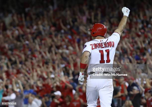 Ryan Zimmerman of the Washington Nationals celebrates after hitting a game winning 3 run home run against the Chicago Cubs in the eighth inning...