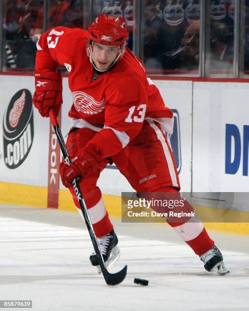 Pavel Datsyuk of the Detroit Red Wings skates up ice with the puck during a NHL game against the St. Louis Blues on April 2, 2009 at Joe Louis Arena...