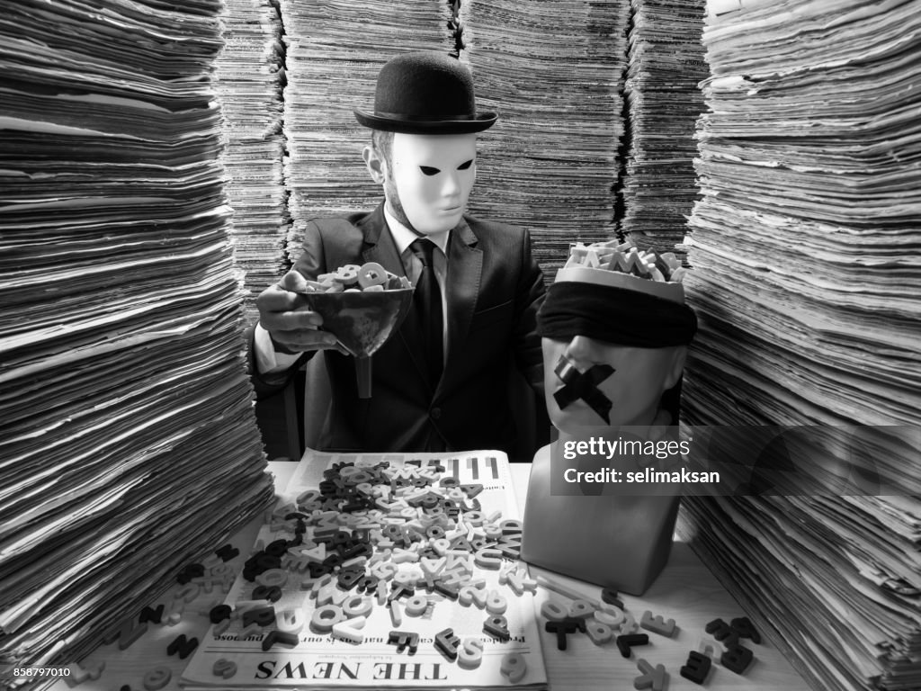 Censornet Agent Censor Agent Reading Newspaper In Media Library For Censorship High-Res ...