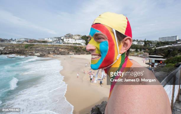 Rob Page, a local Tamarama Beach lifesaver takes part in the Rainbow Walk between Bondi Beach and Bronte Beach on October 8, 2017 in Sydney,...