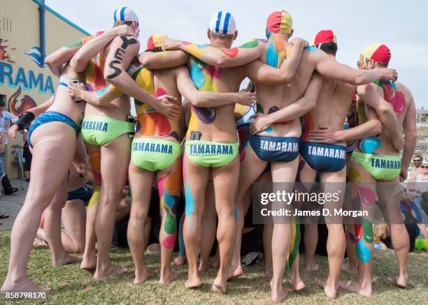 Lifesavers from the Tamarama surf lifesaving club with body paint take part in the Rainbow Walk between Bondi Beach and Bronte Beach on October 8,...