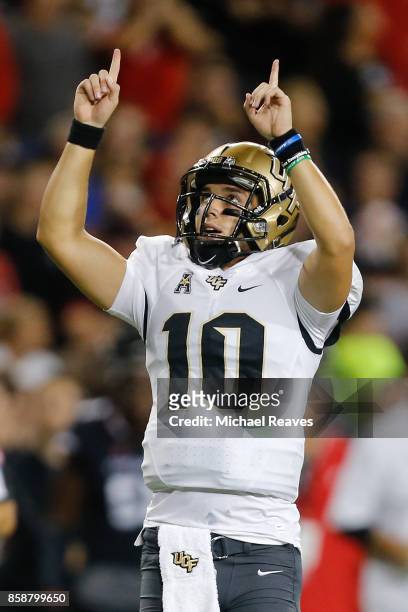 McKenzie Milton of the UCF Knights celebrates a touchdown pass against the Cincinnati Bearcats during the first half at Nippert Stadium on October 7,...