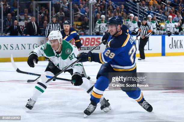 Vince Dunn of the St. Louis Blues takes a shot as Adam Cracknell of the Dallas Stars defends on October 7, 2017 at Scottrade Center in St. Louis,...