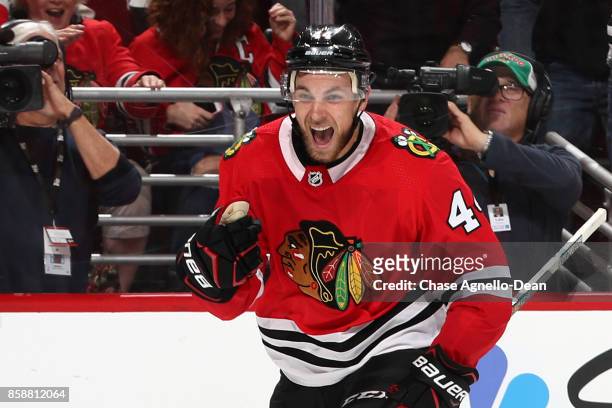 Jan Rutta of the Chicago Blackhawks celebrates after scoring his first NHL career goal in the second period against the Columbus Blue Jackets at the...