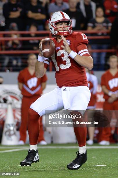 Quarterback Tanner Lee of the Nebraska Cornhuskers drops back to pass against the Wisconsin Badgers at Memorial Stadium on October 7, 2017 in...