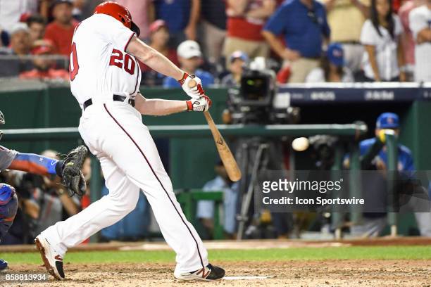Washington Nationals second baseman Daniel Murphy hits an eighth inning single during game two of the NLDS between the Chicago Cubs and the...