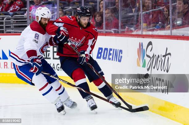 Nathan Walker of the Washington Capitals and Jordie Benn of the Montreal Canadiens battle for the puck in the third period at Capital One Arena on...