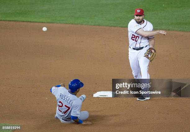 Washington Nationals second baseman Daniel Murphy has Chicago Cubs shortstop Addison Russell out at second base on a double play to end the game...