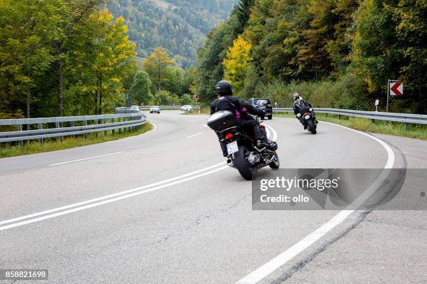 cars and bikers on german federal road 317 - car and motorcycle on mountain road stock pictures, royalty-free photos & images