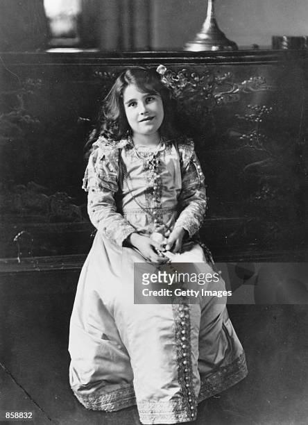 The future Queen Elizabeth, Lady Elizabeth Bowes-Lyon, poses in 1909 at Glamis Castle, her childhood home in Angus, Scotland. The Queen Mother, the...