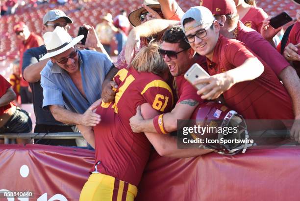Jake Olson, who is blind, jumps into the crowd after a college football game between the Oregon State Beavers and the USC Trojans on October 7 at Los...