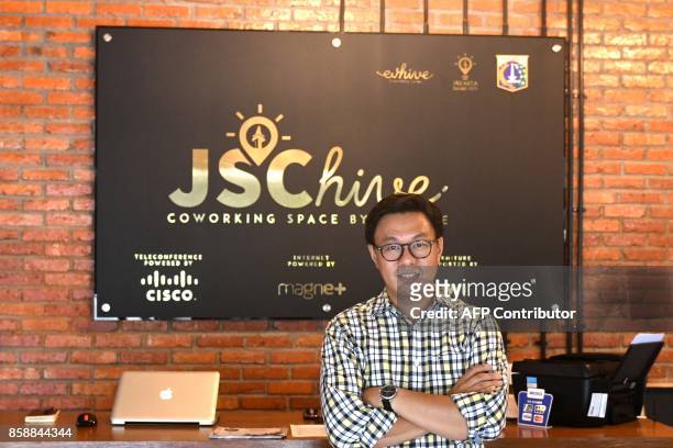 This picture taken on September 12, 2017 shows Willson Cuaca, one of the co-owners of the EV-Hive event space, a co-working space, in Jakarta....