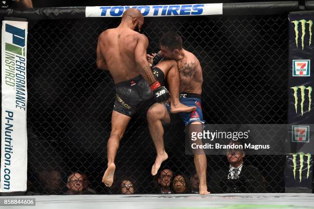 Demetrious Johnson knees Ray Borg in their UFC flyweight championship bout during the UFC 216 event inside T-Mobile Arena on October 7, 2017 in Las...