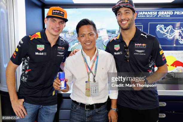 Daniel Ricciardo of Australia and Red Bull Racing and Max Verstappen of Netherlands and Red Bull Racing meet Olympic Champion Judo athlete Tadahiro...
