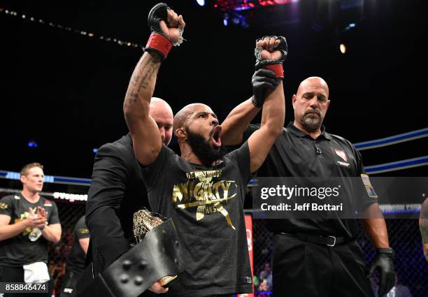 Demetrious Johnson celebrates after his submission victory over Ray Borg in their UFC flyweight championship bout during the UFC 216 event inside...