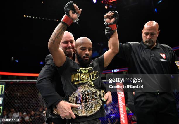 Demetrious Johnson celebrates after his submission victory over Ray Borg in their UFC flyweight championship bout during the UFC 216 event inside...