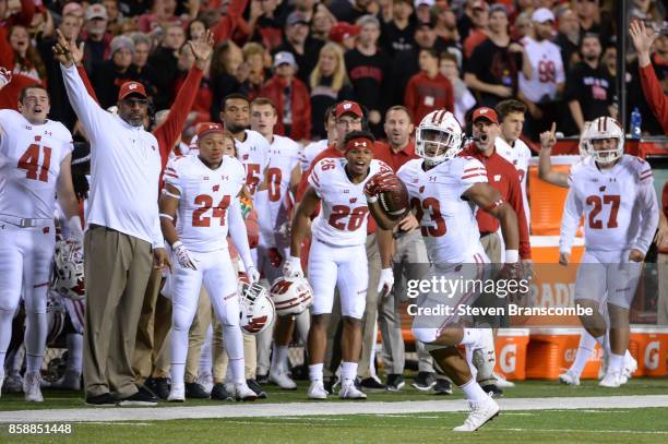 Running back Jonathan Taylor of the Wisconsin Badgers scores on a run against the Nebraska Cornhuskers at Memorial Stadium on October 7, 2017 in...