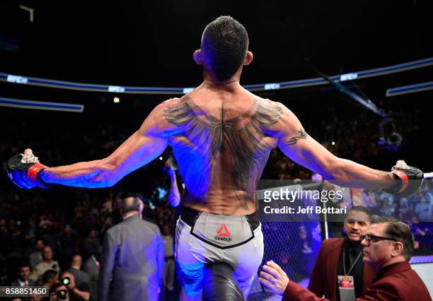 Tony Ferguson celebrates after his submission victory over Kevin Lee in their interim UFC lightweight championship bout during the UFC 216 event...
