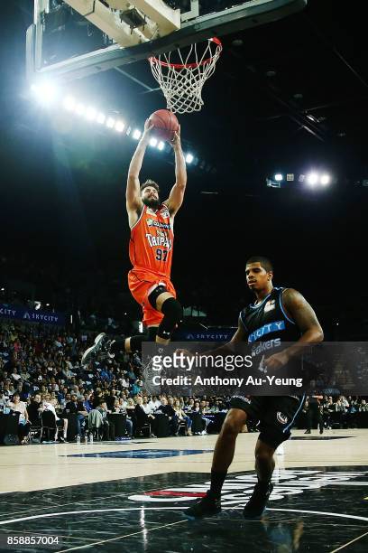 Jarrad Weeks of the Taipans goes to the basket against Edgar Sosa of the Breakers during the round one NBL match between the New Zealand Breakers and...
