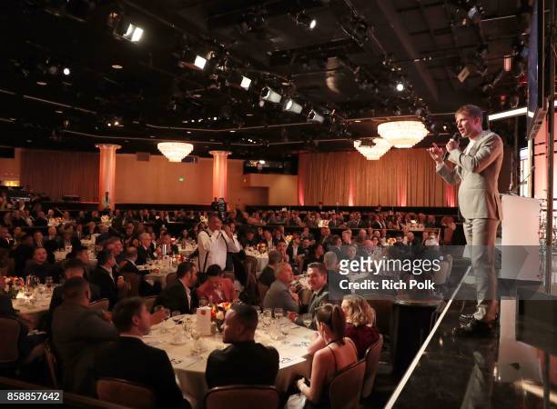 Auctioneer Gabriel Butu speaks onstage at Point Honors Los Angeles 2017, benefiting Point Foundation, at The Beverly Hilton Hotel on October 7, 2017...