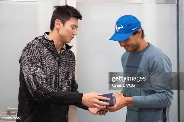 Chinese swimmer Ning Zetao meets with Spanish tennis player Rafael Nadal on day eight of 2017 China Open on October 7, 2017 in Beijing, China.