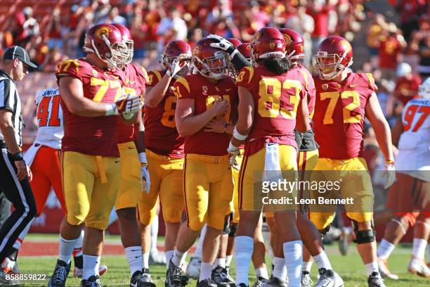 Jake Olson of the USC Trojans celebrates with his team mates after hiking the ball in a 38-10 win against the Oregon State Beavers at Los Angeles...