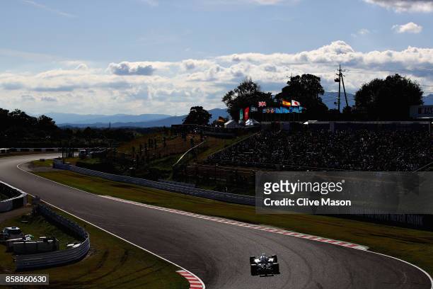 Lewis Hamilton of Great Britain driving the Mercedes AMG Petronas F1 Team Mercedes F1 WO8 on track during the Formula One Grand Prix of Japan at...