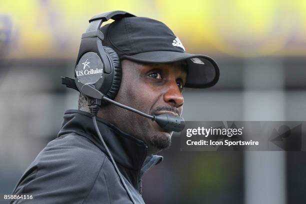 East Carolina Pirates head coach Scottie Montgomery watches a replay on the Jumbotron during a game between the Temple Owls and the East Carolina...