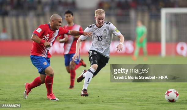 Dennis Jastrzembski of Germany is challenged by Alexander Roman of Costa Rica during the FIFA U-17 World Cup India 2017 group C match between Germany...