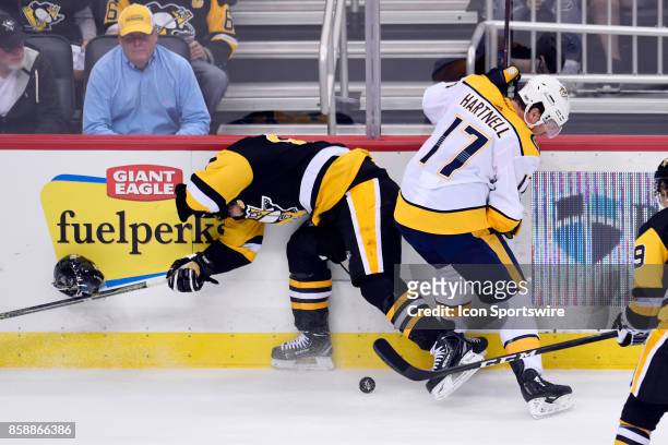 Nashville Predators Left Wing Scott Hartnell knocks off Pittsburgh Penguins center Sidney Crosby helmet during the third period in the NHL game...