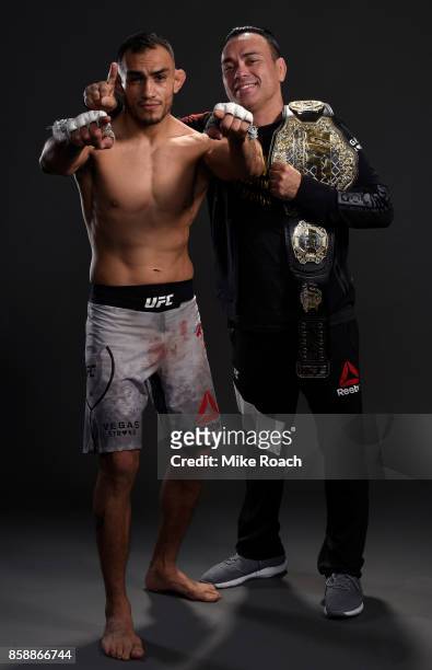 Interim lightweight champion Tony Ferguson poses for a portrait backstage with coach Eddie Bravo after his victory over Kevin Lee during the UFC 216...