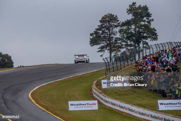 The Mercedes AMG GT3 of Ben Keating, Jeroen Bleekemolen, of the Netherlands, and Mario Farnbacher, of Germany, races on the track during the Motul...