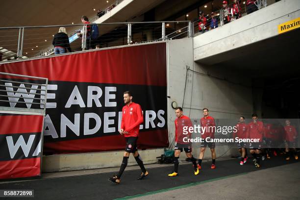 Robert Cornthwaite of the Wanderers and his team walk onto the field during the round one A-League match between the Western Sydney Wanderers and the...