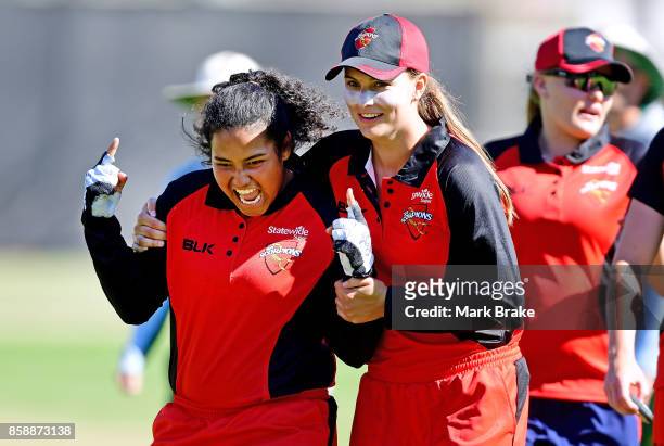 Tabatha Saville and Alex Price celebrate the win over Tasmania during the WNCL match between South Australia and Tasmania at Adelaide Oval No.2 on...