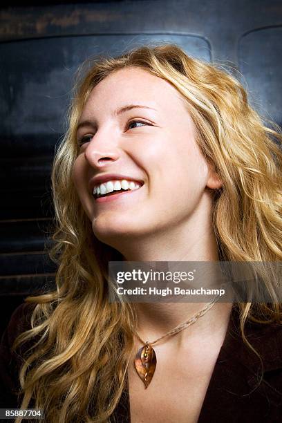 blonde woman laughing - pendants foto e immagini stock