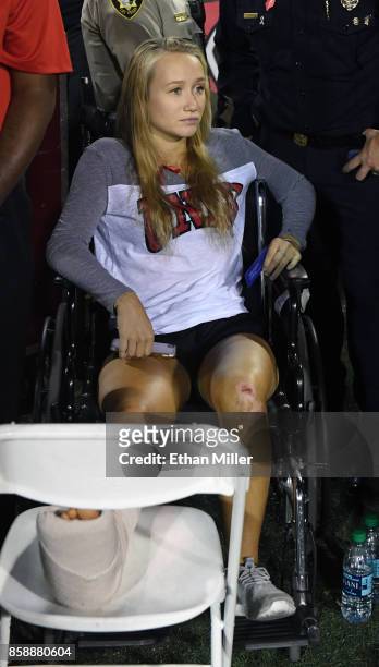 Addison Short, who was injured in Sunday's mass shooting, looks on before a game between the San Diego State Aztecs and the UNLV Rebels at Sam Boyd...
