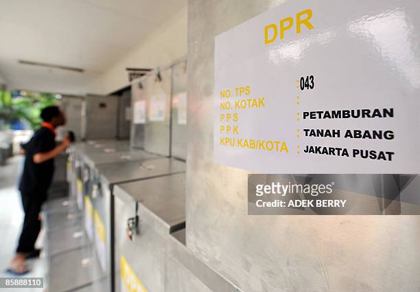 An official of electoral commission checks sealed ballot boxes at a subdistrict office in Jakarta on April 10 before a national tabulation which will...