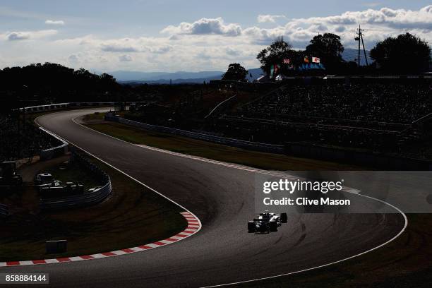 Lewis Hamilton of Great Britain driving the Mercedes AMG Petronas F1 Team Mercedes F1 WO8 on track during the Formula One Grand Prix of Japan at...